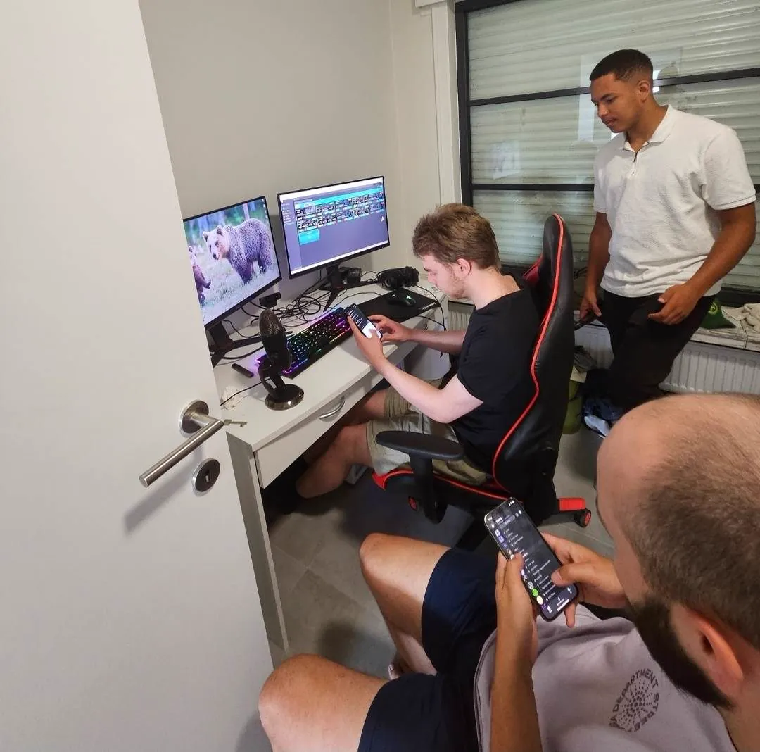 Team working at a desk setup during an in-person meetup